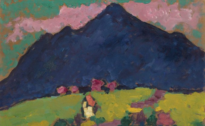 Painting of a looming mountain with green field and murky objects in the foreground